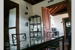 a room with a glass table and a mirror at "VILLA SERVANDA" - Casa Canaria construida a PRINCIPIOS DEL SIGLO XIX in Puntagorda