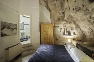 A bed or beds in a room at Residence San Pietro Barisano