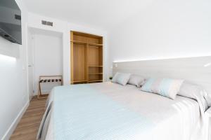 Ein Bett oder Betten in einem Zimmer der Unterkunft Aparthotel Ciudad Laurel