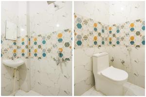 
A bathroom at OYO 70412 Hotel Alwar Delight
