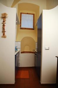a small kitchen with a sink and a window at Santacroce 52 in Florence