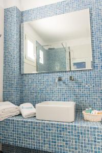 A bathroom at Poseidon Hotel Suites
