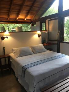 Cama ou camas em um quarto em O Sitio - Ilha Grande