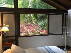 Cama ou camas em um quarto em O Sitio - Ilha Grande