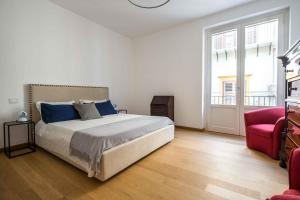 Posteľ alebo postele v izbe v ubytovaní Magione Apartment with Terrace by Wonderful Italy