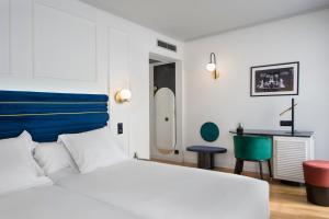 Un pat sau paturi într-o cameră la Hotel Inca