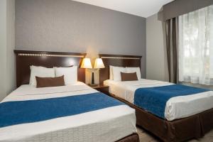 Postel nebo postele na pokoji v ubytování Comfort Suites Seabrook - Kemah