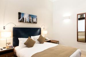 Cama o camas de una habitación en Suffolk Lane by Blueprint Living