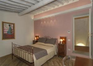 Postel nebo postele na pokoji v ubytování Villa Agnolaccio Residenza d'Epoca