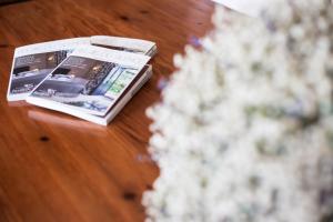 a magazine sitting on top of a wooden table at Relais Pian delle Starze in Marina di Camerota