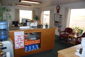 an office with a counter with a drink cooler at Budget Host Exit 254 Inn in Loveland