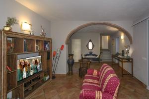 TV a/nebo společenská místnost v ubytování Villa Agnolaccio Residenza d'Epoca