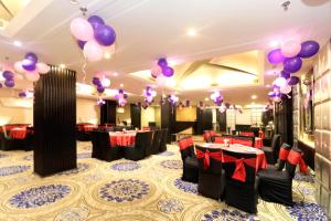 a banquet hall with purple and purple balloons at The Toy Hotel in Chandīgarh