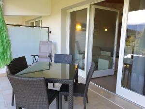 a glass table and chairs in a room at Villa Maria in Tremosine Sul Garda