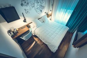 Cama ou camas em um quarto em Hotel Bernina Geneva
