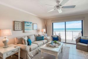 a living room with a couch and a table at Sunrise Terrace in St. Augustine