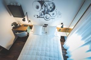 Cama ou camas em um quarto em Hotel Bernina Geneva