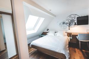 Cama ou camas em um quarto em Hotel Bernina Geneva