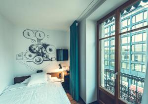 Cama ou camas em um quarto em Hotel Bernina Geneva