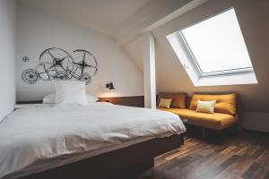 Cama ou camas em um quarto em Hotel Bernina Geneva