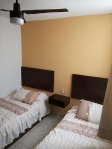 Cama o camas de una habitación en Hotel Posada San Juan