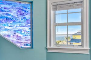 a window with a view of the ocean at Beachcomber Penthouse in St. Augustine