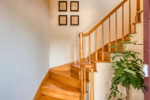 a wooden staircase with a potted plant at 64 Hypolita Street in St. Augustine +42 photos
