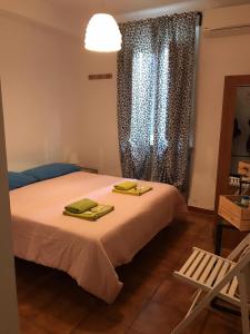 Postel nebo postele na pokoji v ubytování A Casa di Lucia