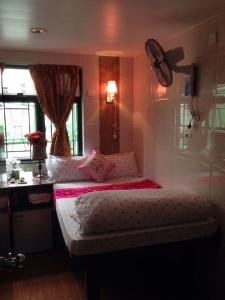 Ένα ή περισσότερα κρεβάτια σε δωμάτιο στο Marrigold Hostel