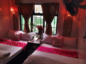 Ένα ή περισσότερα κρεβάτια σε δωμάτιο στο Marrigold Hostel