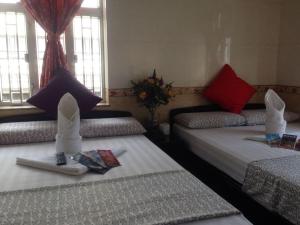 Ένα ή περισσότερα κρεβάτια σε δωμάτιο στο Marrigold Hostel