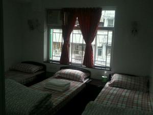 Ένα ή περισσότερα κρεβάτια σε δωμάτιο στο Marrigold Hostel