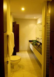 a bathroom with a toilet and a sink at Sang Serene House in Chiang Mai +27 photos