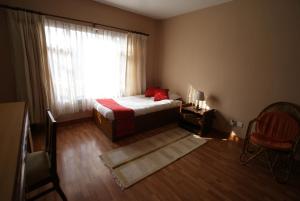 Letto o letti in una camera di ROKPA Guest House