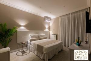 a hotel room with a bed and a table at Ponte Milvio Suite in Rome