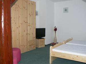 Ένα ή περισσότερα κρεβάτια σε δωμάτιο στο Penzion Na Vápence