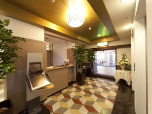 Postel nebo postele na pokoji v ubytování Hotel Grand Fine Toyonaka Minami