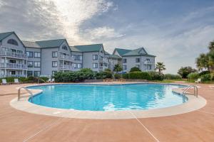 a large swimming pool in front of some apartments at Gulf Shores Plantation #1262 in Gulf Shores