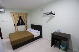 Postel nebo postele na pokoji v ubytování Tengkera Hotel