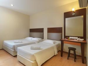 Postel nebo postele na pokoji v ubytování Fenix Inn