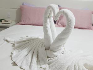 Posteľ alebo postele v izbe v ubytovaní Hotel Cavalinho Branco Flat Service 615