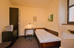 Letto o letti in una camera di Hotel U Zlatého býka