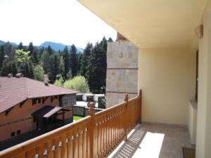 a balcony of a house with a view of the mountains at Eliza Apartment Sequoia in Borovets