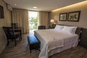 Cama ou camas em um quarto em Grande Hotel Canela
