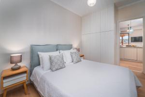 Ένα ή περισσότερα κρεβάτια σε δωμάτιο στο Asteria Apartments