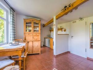 a kitchen with a table and a dining room at Gruppenhaus im Harz in Bad Harzburg