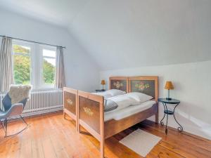 Een bed of bedden in een kamer bij Rustic holiday home with sauna in Bad Harzburg