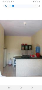 Η κουζίνα ή μικρή κουζίνα στο Casa de temporadas Simone/ Rafael