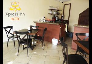 A restaurant or other place to eat at Xpress Inn Hotel