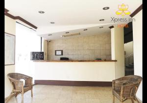 The lobby or reception area at Xpress Inn Hotel